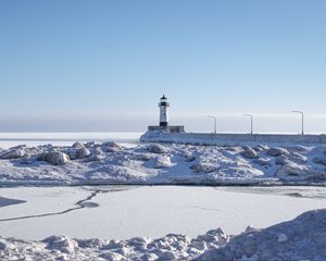 Preview wallpaper lighthouse, coast, snow, water, winter, nature
