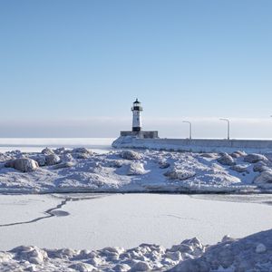 Preview wallpaper lighthouse, coast, snow, water, winter, nature