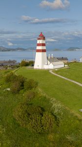 Preview wallpaper lighthouse, field, grass, sea, sky