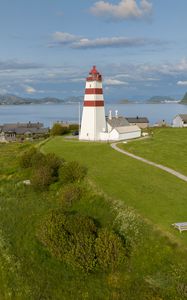 Preview wallpaper lighthouse, field, grass, sea, sky