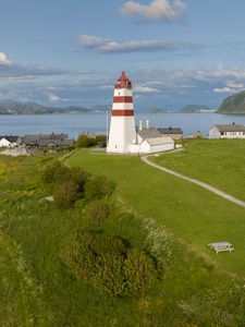 Preview wallpaper lighthouse, field, grass, sea, sky