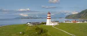 Preview wallpaper lighthouse, field, grass, sea, sky