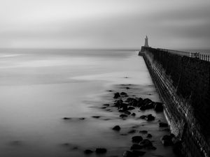 Preview wallpaper lighthouse, gloomy, stones, bw