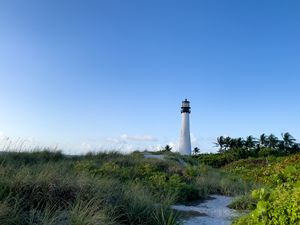 Preview wallpaper lighthouse, grass, trail, sky