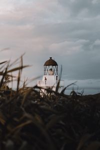 Preview wallpaper lighthouse, grasses, building, coast