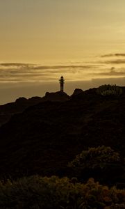 Preview wallpaper lighthouse, hills, silhouettes, evening
