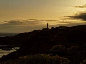Preview wallpaper lighthouse, hills, silhouettes, evening
