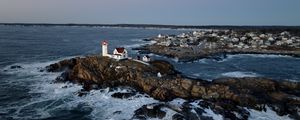 Preview wallpaper lighthouse, house, rocks, sea