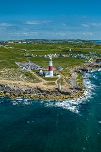 Preview wallpaper lighthouse, island, buildings, sea