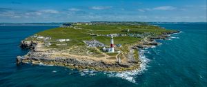 Preview wallpaper lighthouse, island, buildings, sea