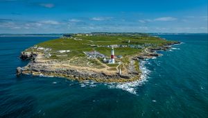 Preview wallpaper lighthouse, island, buildings, sea