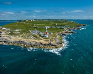 Preview wallpaper lighthouse, island, buildings, sea