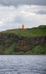 Preview wallpaper lighthouse, island, sea, cliff, grass