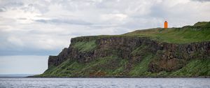 Preview wallpaper lighthouse, island, sea, cliff, grass
