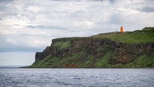 Preview wallpaper lighthouse, island, sea, cliff, grass