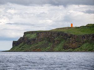 Preview wallpaper lighthouse, island, sea, cliff, grass