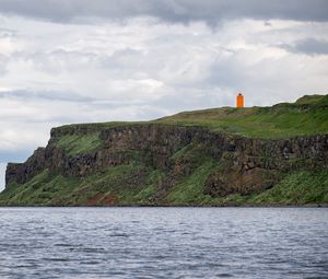 Preview wallpaper lighthouse, island, sea, cliff, grass