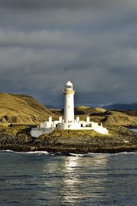 Preview wallpaper lighthouse, island, sea, shore, water