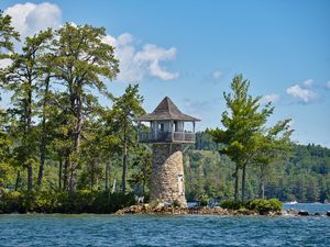 Preview wallpaper lighthouse, island, sea, trees
