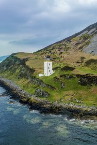 Preview wallpaper lighthouse, island, sea, nature, relief