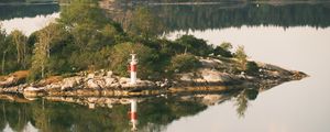 Preview wallpaper lighthouse, island, trees, reflection, lake