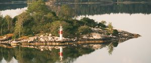 Preview wallpaper lighthouse, island, trees, reflection, lake