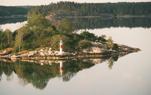 Preview wallpaper lighthouse, island, trees, reflection, lake