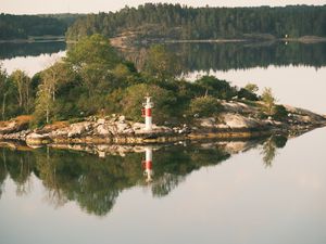 Preview wallpaper lighthouse, island, trees, reflection, lake