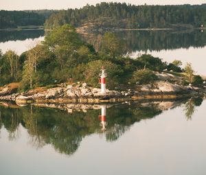 Preview wallpaper lighthouse, island, trees, reflection, lake