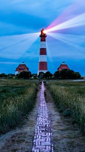 Preview wallpaper lighthouse, light, houses, road, field, grass