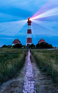 Preview wallpaper lighthouse, light, houses, road, field, grass