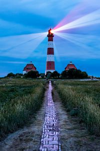 Preview wallpaper lighthouse, light, houses, road, field, grass