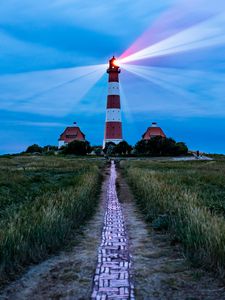 Preview wallpaper lighthouse, light, houses, road, field, grass