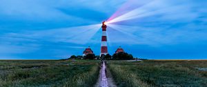 Preview wallpaper lighthouse, light, houses, road, field, grass