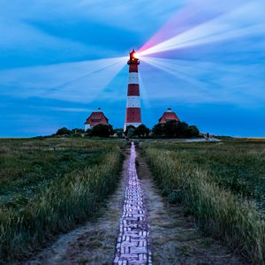 Preview wallpaper lighthouse, light, houses, road, field, grass