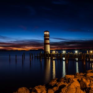 Preview wallpaper lighthouse, night, coast, reflection