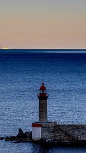 Preview wallpaper lighthouse, ocean, water, waves, twilight