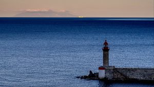 Preview wallpaper lighthouse, ocean, water, waves, twilight