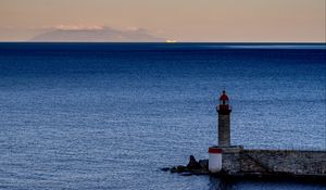 Preview wallpaper lighthouse, ocean, water, waves, twilight