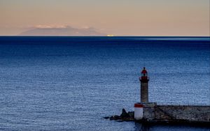 Preview wallpaper lighthouse, ocean, water, waves, twilight