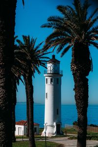 Preview wallpaper lighthouse, palm trees, sea, building, architecture, coast