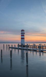 Preview wallpaper lighthouse, pier, sea, sunset, sky