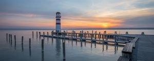 Preview wallpaper lighthouse, pier, sea, sunset, sky