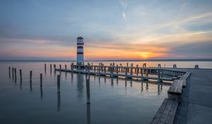 Preview wallpaper lighthouse, pier, sea, sunset, sky