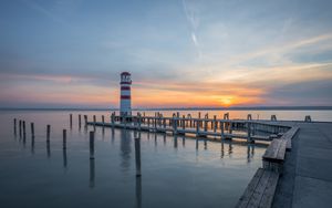 Preview wallpaper lighthouse, pier, sea, sunset, sky