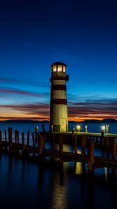Preview wallpaper lighthouse, pier, sea, lights, twilight