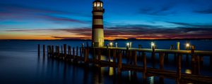 Preview wallpaper lighthouse, pier, sea, lights, twilight