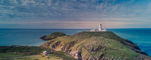 Preview wallpaper lighthouse, relief, flowers, sea