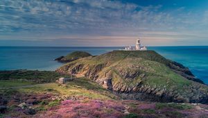 Preview wallpaper lighthouse, relief, flowers, sea