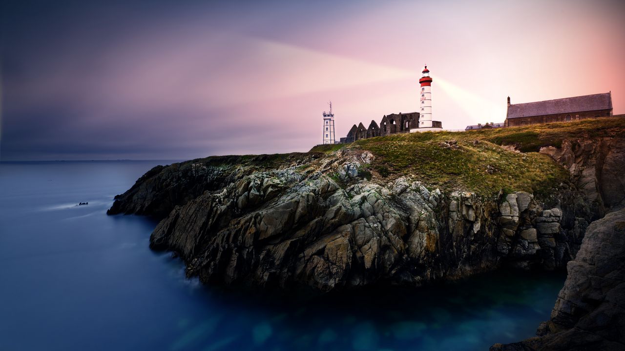 Wallpaper lighthouse, rock, cliff, sea, rays